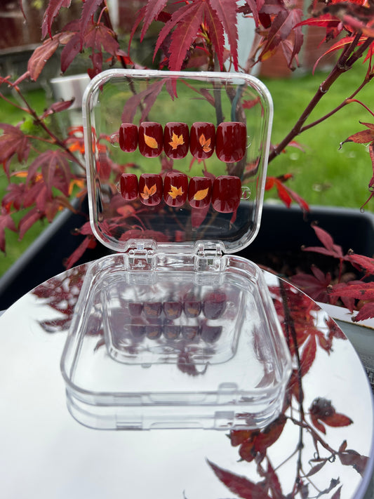 Luxury press-on nails, autumn, burgundy red, Japanese maple leaf.
