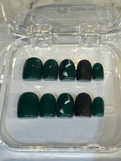 Luxury press-on nails, dark green, black 3D details, white flowers, glossy finish.