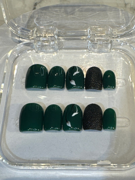 Luxury press-on nails, dark green, black 3D details, white flowers, glossy finish.