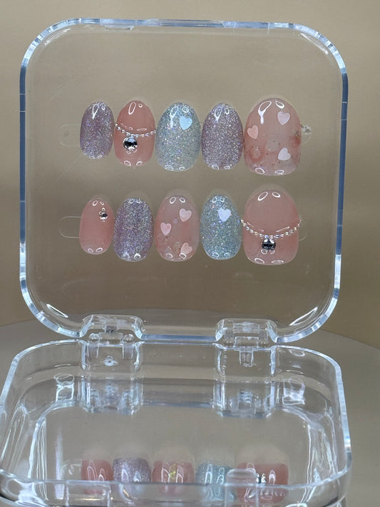 Round tip short natural press on nails. With cute design ,rhinestones and heart. Silver glitter ,and pink nude polish
