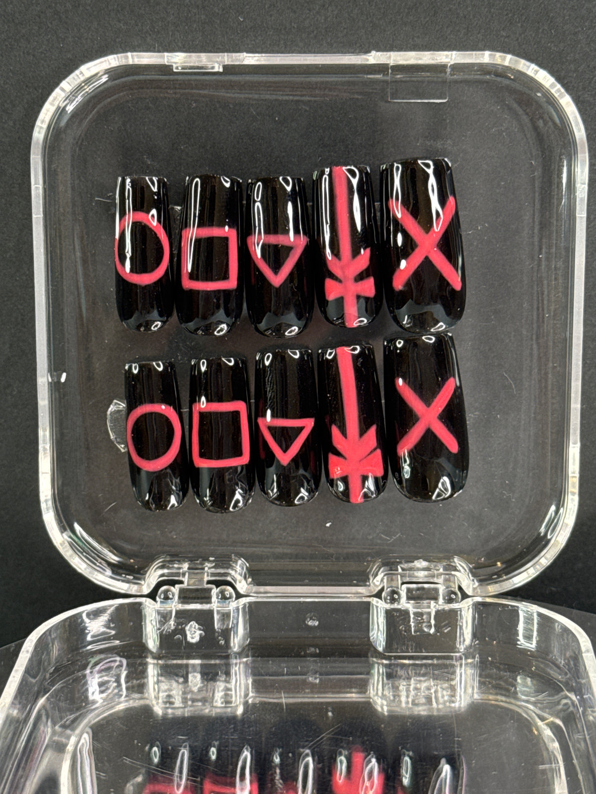 Coffin / ballerina press-on nails with a playful squid game-inspired design. Signature color of the games pink and black-