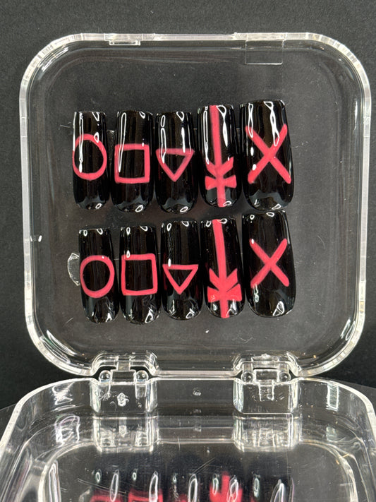 Coffin / ballerina press-on nails with a playful squid game-inspired design. Signature color of the games pink and black-