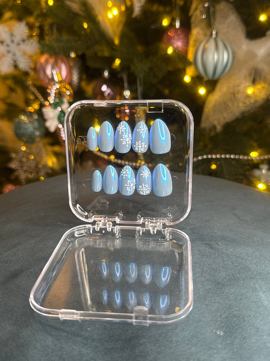 Luxury press-on nails, light blue glitter, snowflakes, winter, Christmas.
