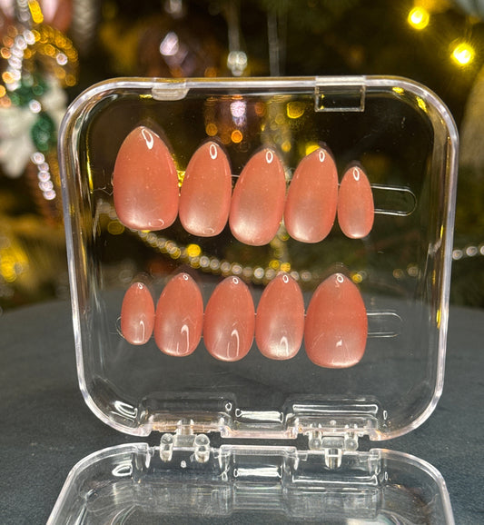 Luxury press-on nails, glitter orange, glossy orange finish, crystals.
