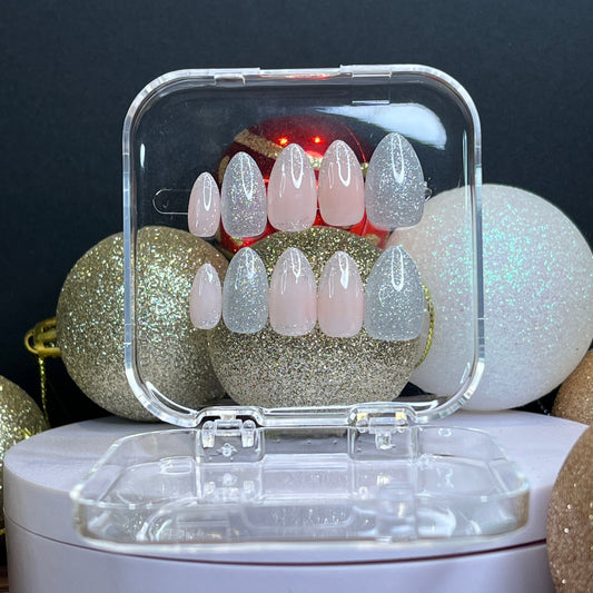 Luxury press-on nails, light pink, light peach, silver glitter, shimmering glitter, party, Christmas.
