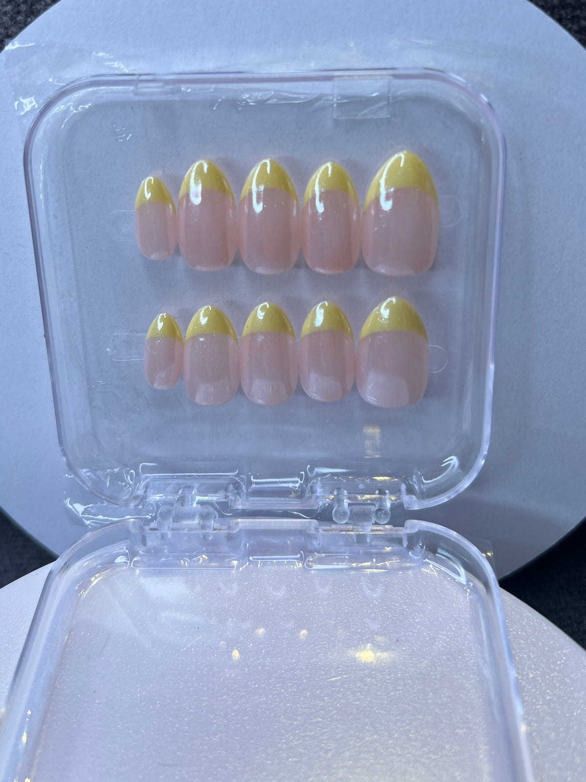Luxury press-on nails, lemon yellow French manicure, ombré, light pink, glossy nude.
