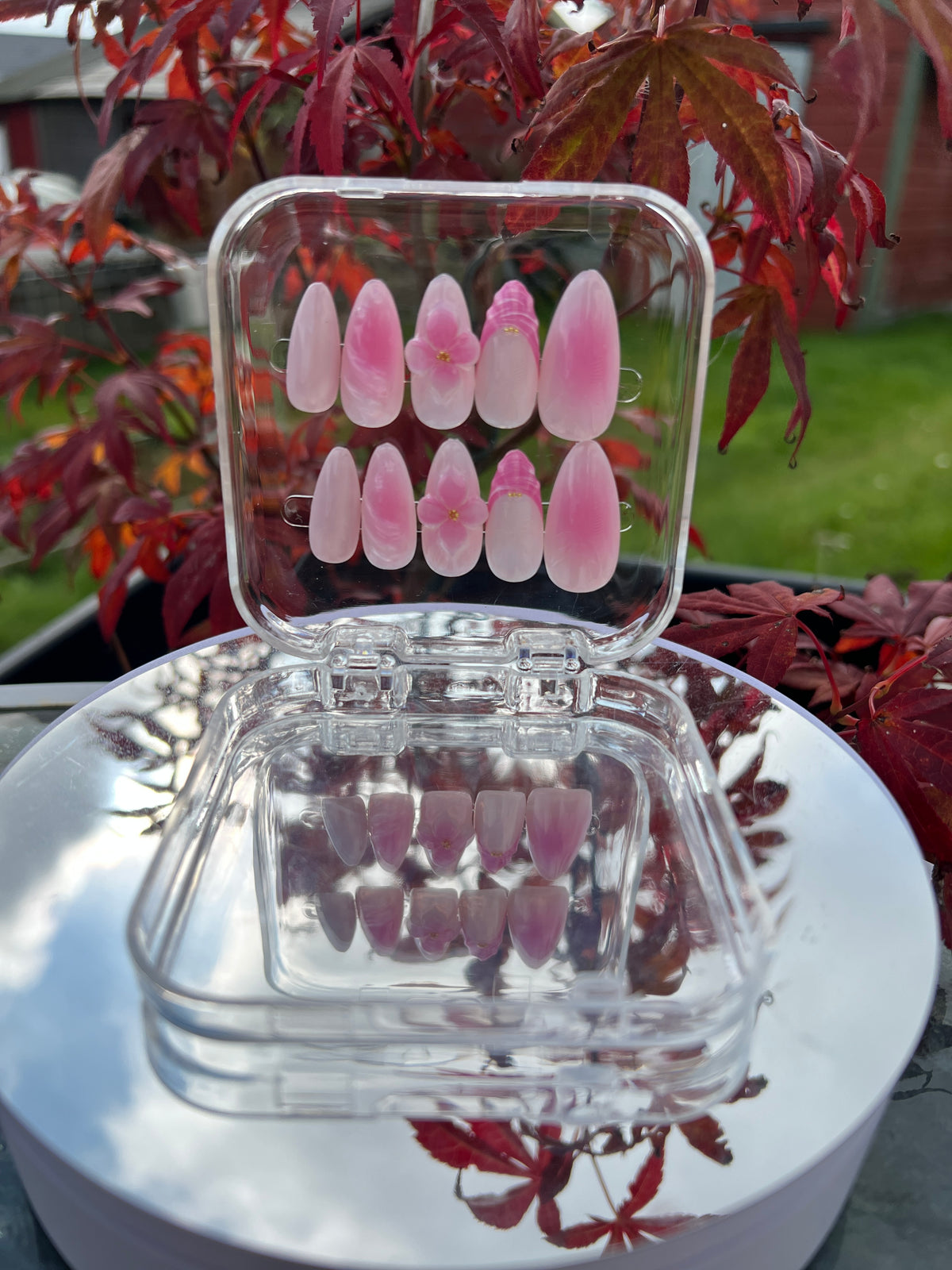 Medium Almond 3D Nails with pink floral 3D flowers and ombre gradient. Elegant press-on design featuring dimensional flower embellishments in soft pink tones that blend beautifully to your nail.